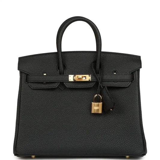 Black leather handbag with gold front clasp, padlock charm, and top handles