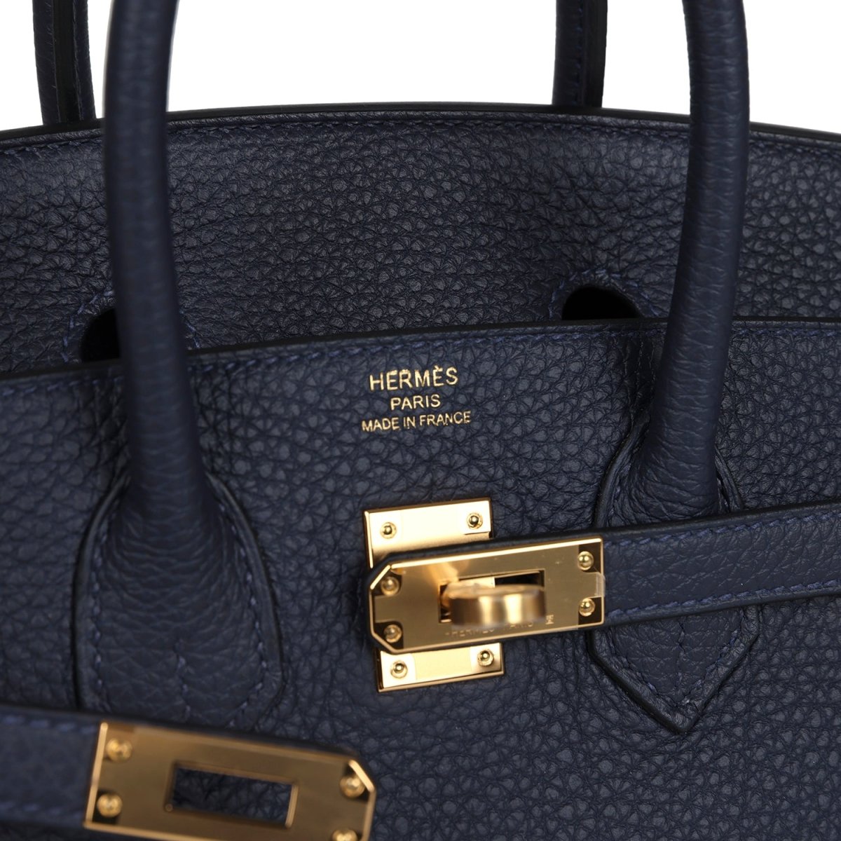 Hermes Birkin 25 handbag interior panel with Hermes branding and gold lock hardware.