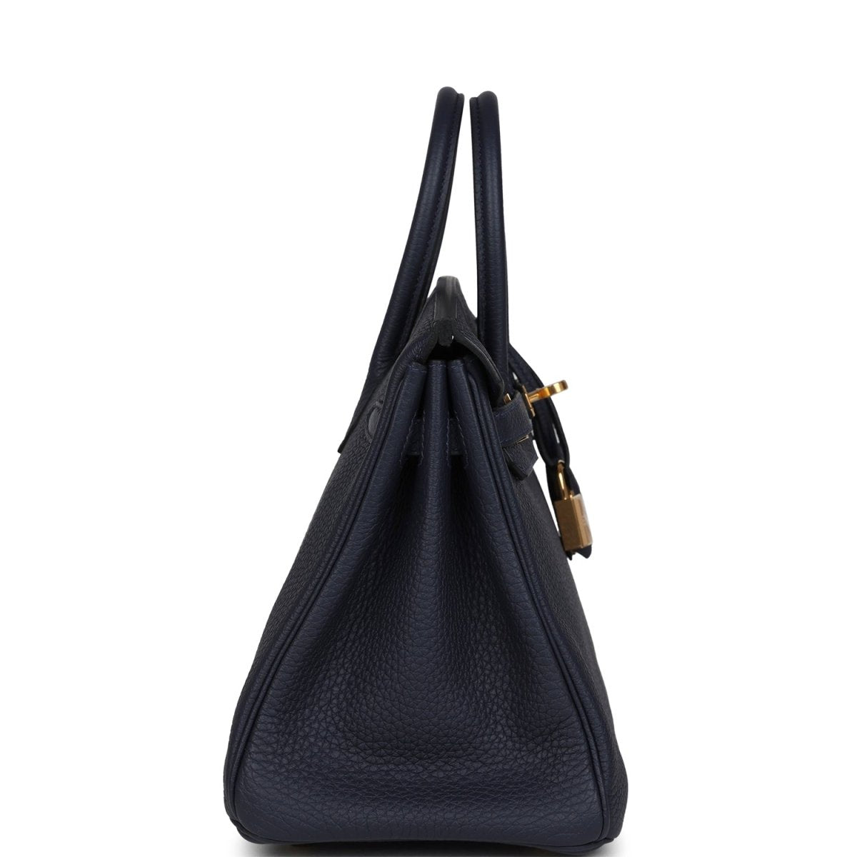 Hermes Birkin 25 handbag in dark blue leather with top handles, viewed from the side.
