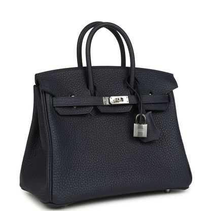 Birkin 25 handbag three-quarter view in dark blue pebbled leather with front lock