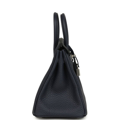 Birkin 25 handbag side view with dark blue pebbled leather and metal lock charm