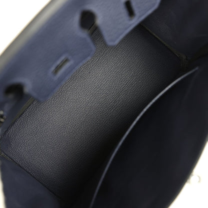 Birkin 25 handbag close-up of dark blue pebbled leather side panel and stitching