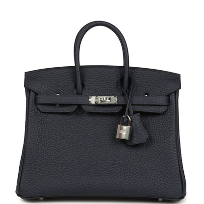 Birkin 25 handbag front view in dark blue pebbled leather with silver-toned lock