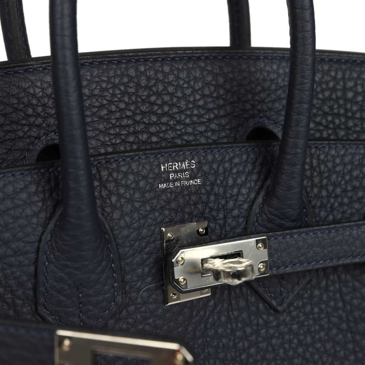Birkin 25 handbag interior with brand stamp and front clasp hardware