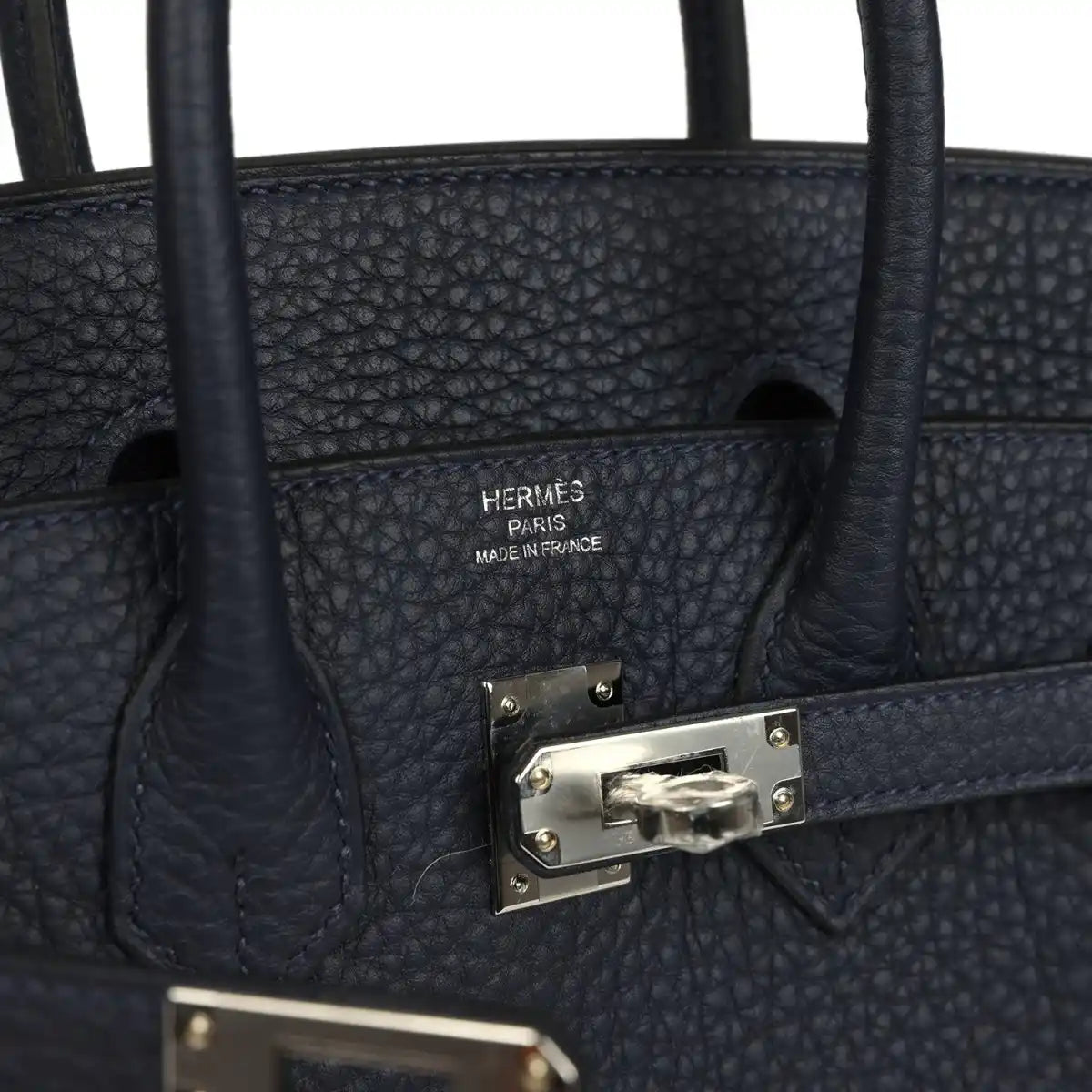 Birkin 25 handbag interior with brand stamp and front clasp hardware