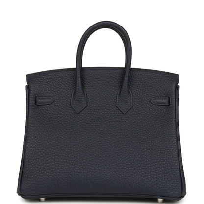 Birkin 25 handbag front view in dark blue pebbled leather with double top handles