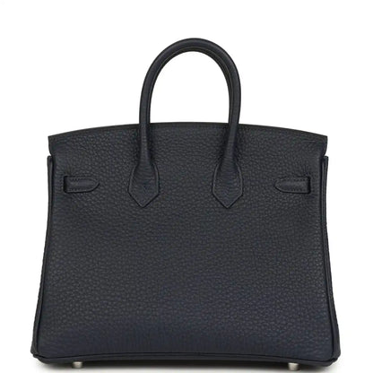 Birkin 25 handbag front view in dark blue pebbled leather with double top handles