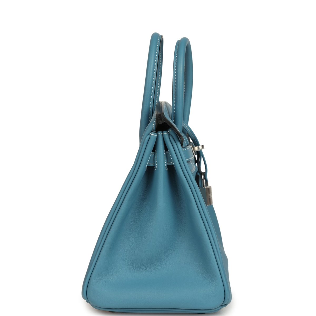 Blue Birkin 25 handbag side view with top handles and hanging luggage tag