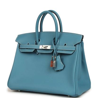 Blue Birkin 25 handbag front with top handles, clasp, and hanging leather charm
