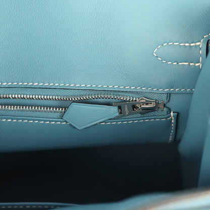 Blue Birkin 25 handbag interior view of zipper track and stitched edge