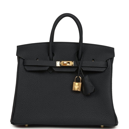 Black leather Birkin-style handbag 25 with gold hardware, top handles, and hanging key charm