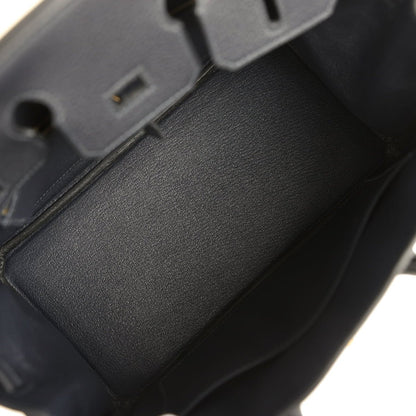 Black leather Birkin-style handbag interior with dark lining and edge trim