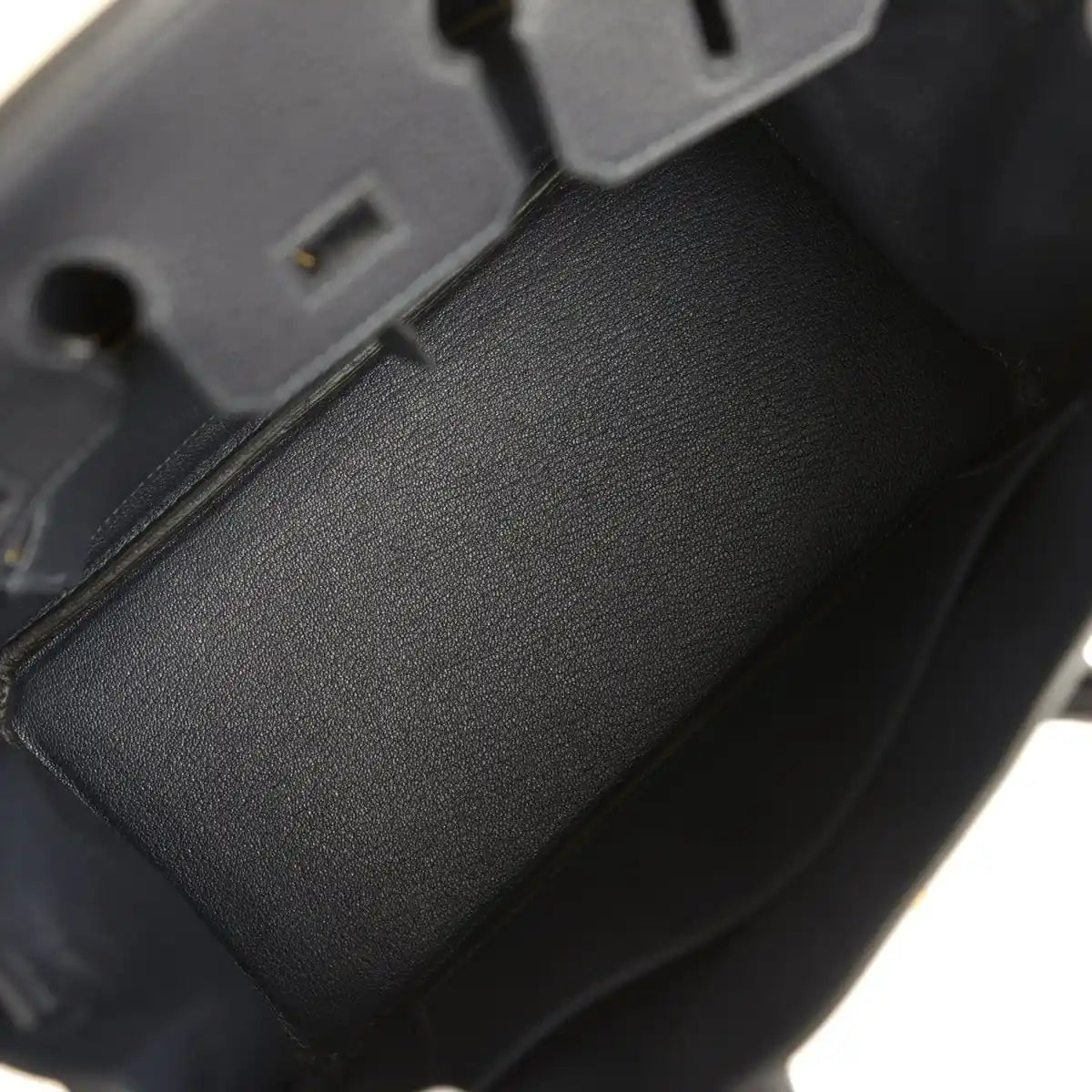Black leather Birkin-style handbag interior with dark lining and edge trim