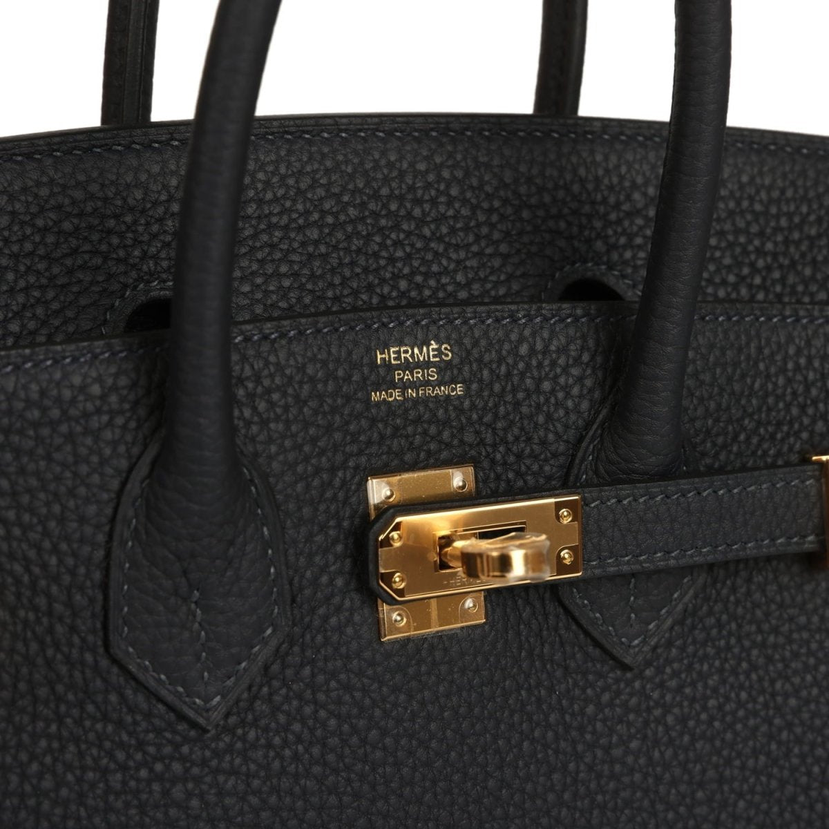 Black leather Birkin-style handbag with gold turn-lock and top handle tabs