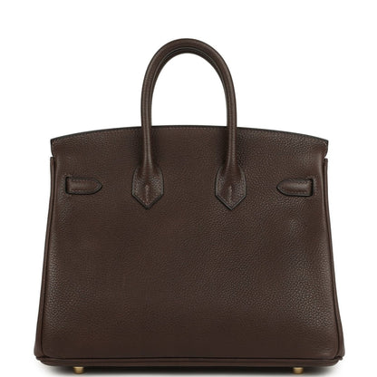 Brown leather tote with top handles, front flap and gold-tone details