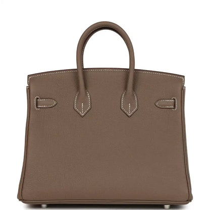 Hermes Birkin 25 handbag front view in taupe textured leather with signature strap details