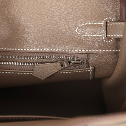 Hermes Birkin 25 handbag interior close-up with zip track, silver-tone zipper pull, and tab