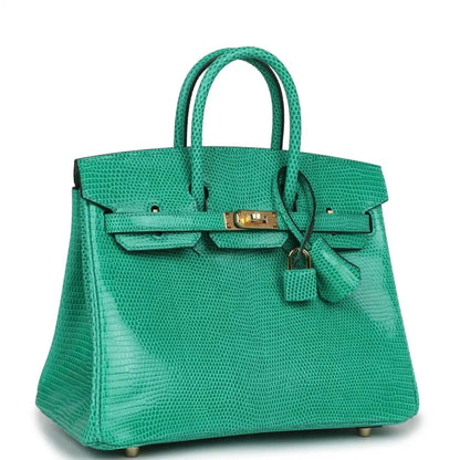 Mint green lizard handbag with gold-tone lock, front flap, and tie detail
