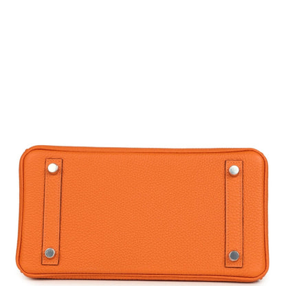 Orange leather Birkin 25 handbag base panel with four silver studs at corners