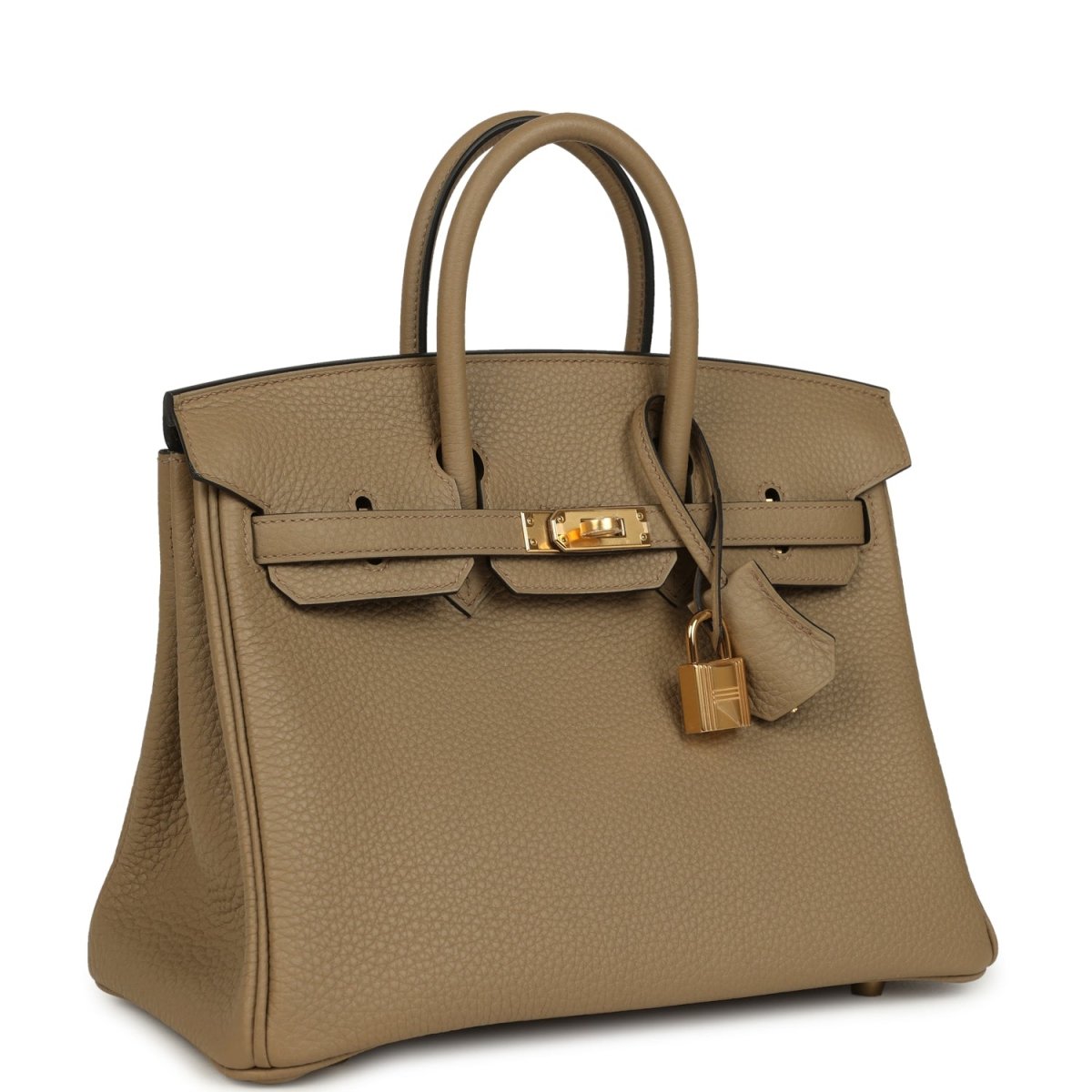 Beige pebbled leather handbag with top handles, gold hardware, and turn-lock