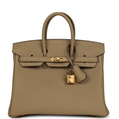 Beige pebbled leather handbag with top handles and gold turn-lock clasp