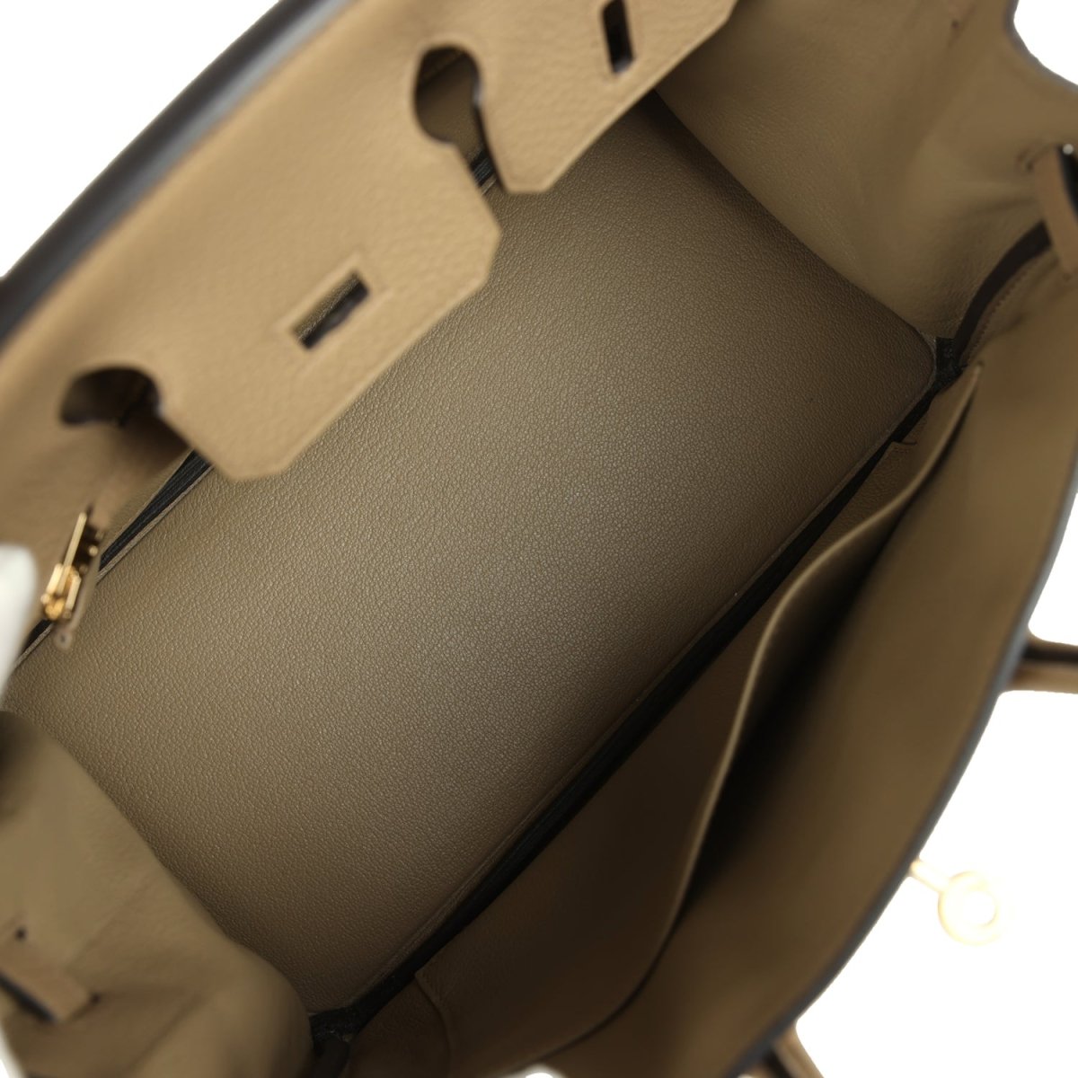Beige leather handbag interior with partition and open top