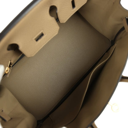 Beige leather handbag interior with partition and open top