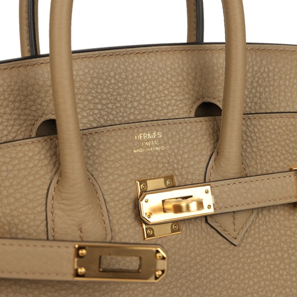 Beige leather handbag interior with gold hardware and Hermes Paris stamp