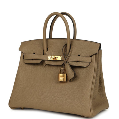 Beige pebbled leather handbag front with top handles and gold turn-lock clasp