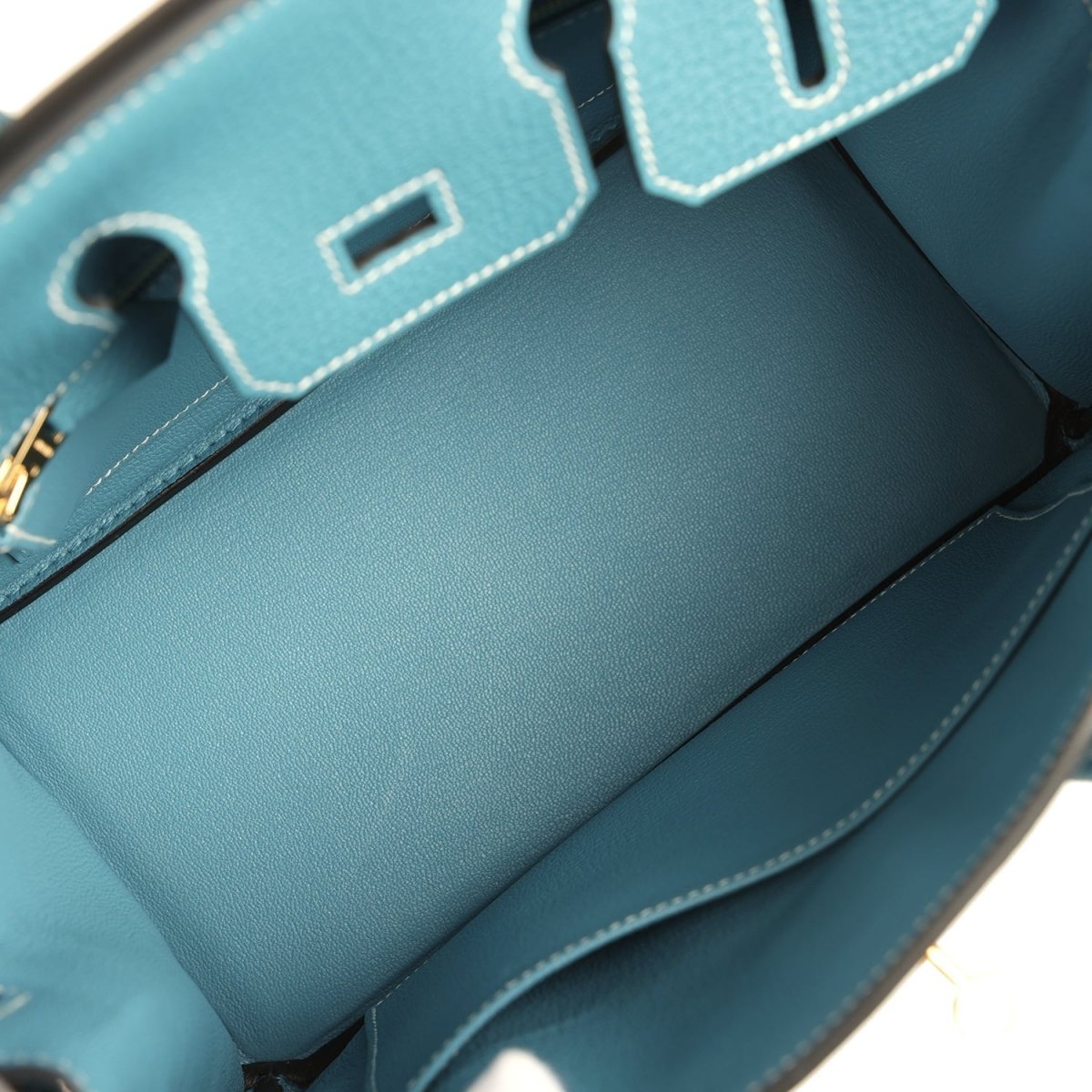 Teal-blue Togo leather handbag interior and front flap area with stitched leather panels