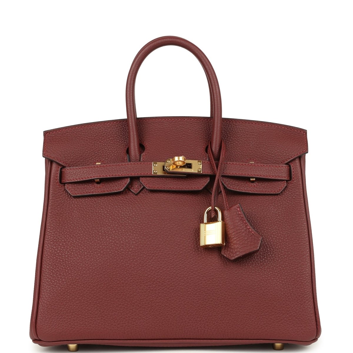 Burgundy leather top-handle handbag with gold hardware, front flap and turn-lock.