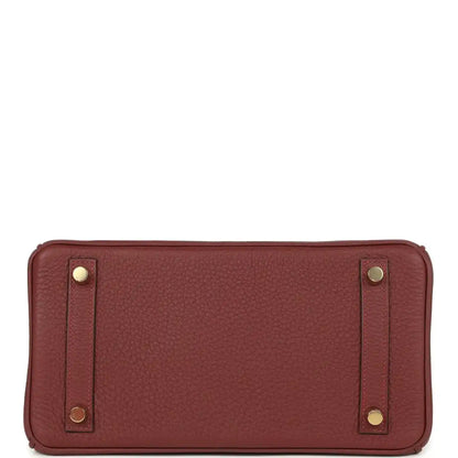 Burgundy leather interior with Hermès stamp and gold hardware detail.