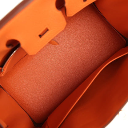 Hermes Birkin 25 handbag interior with orange leather lining and flat partition