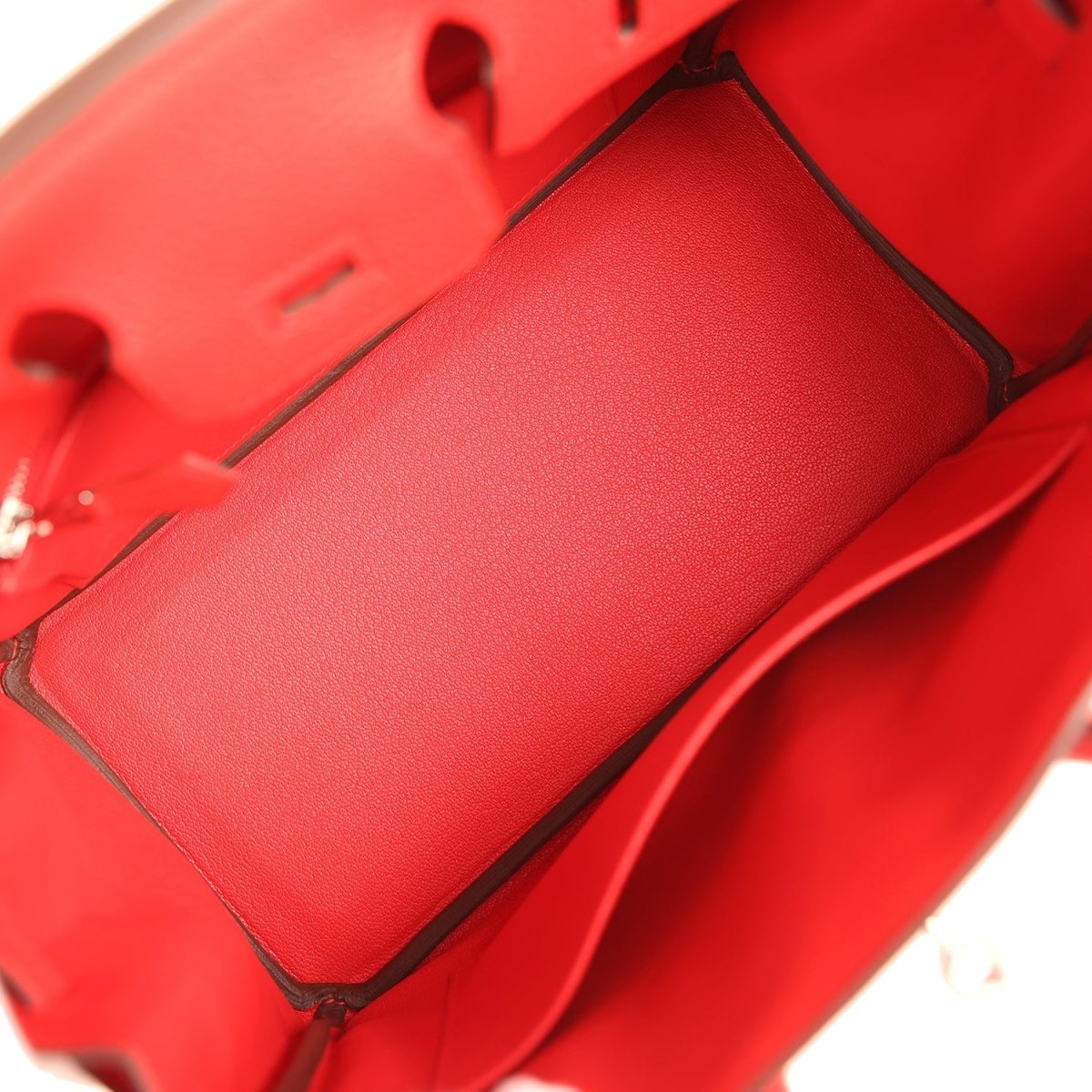 Red Hermes Birkin 25 handbag interior with leather lining and open top frame