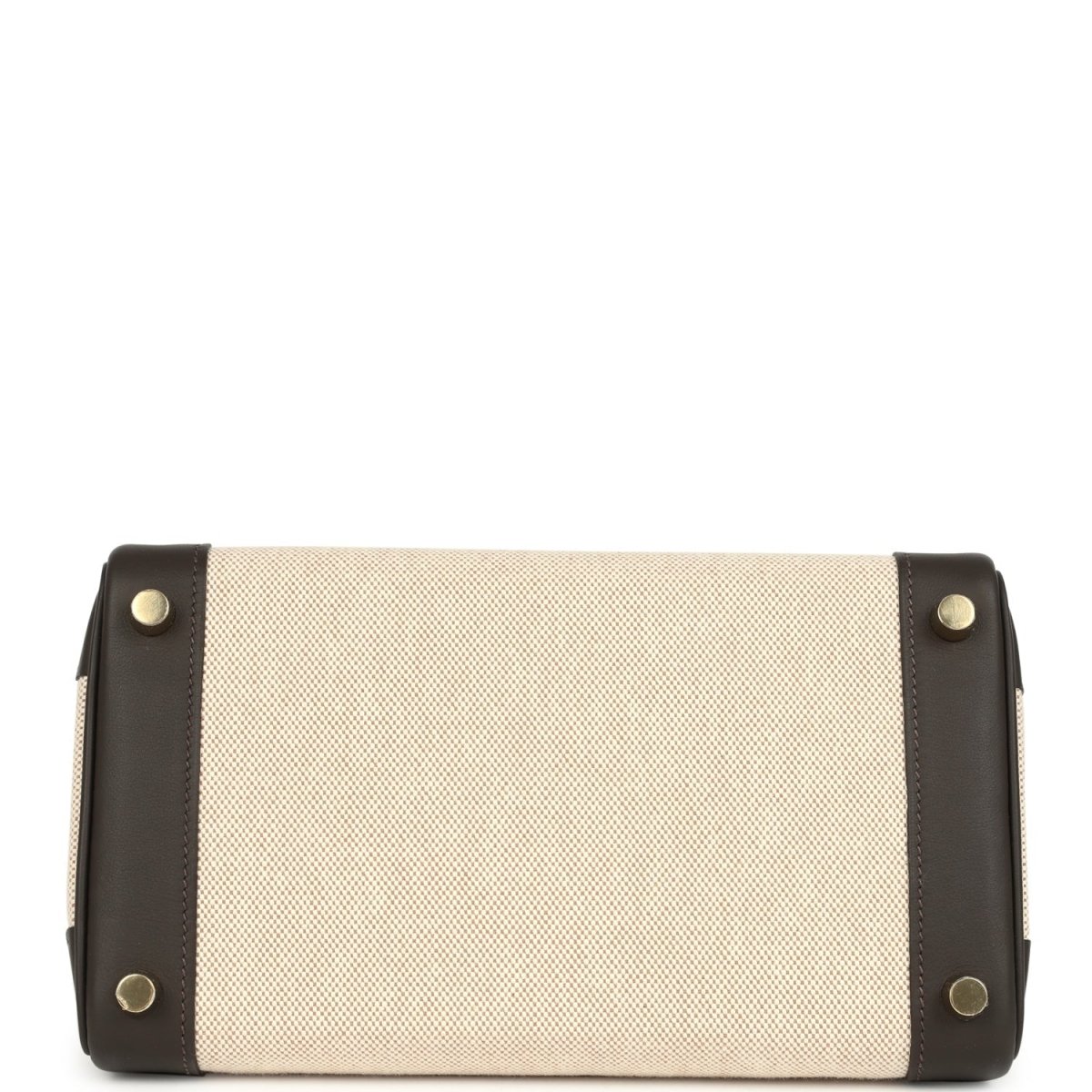 Rectangular handbag with beige canvas front and dark leather corners, gold-tone button studs