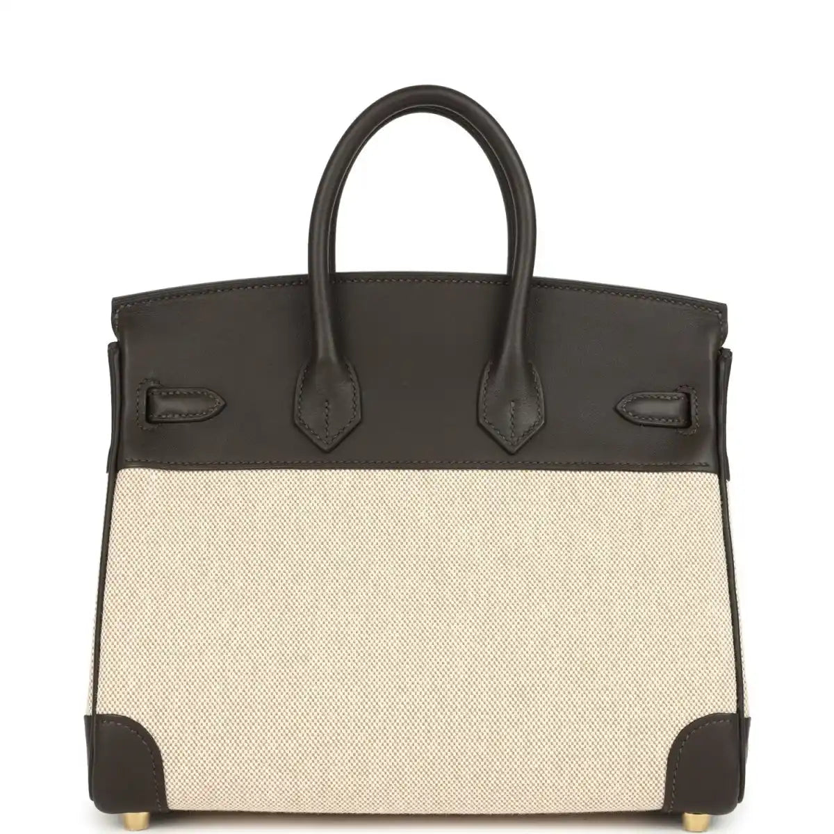Two-tone handbag with dark leather handles, beige canvas body, gold-tone feet and trim