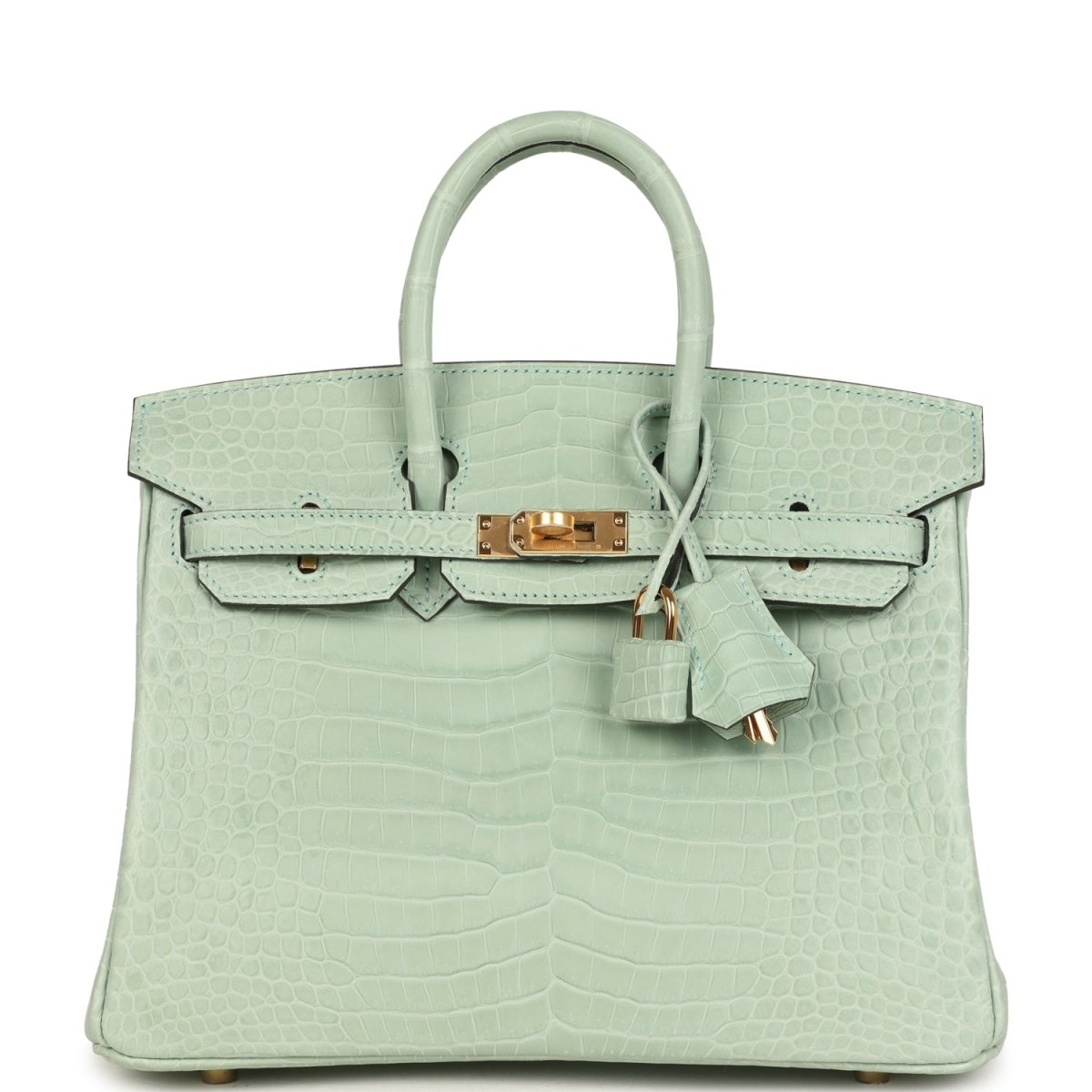 Light green croc-embossed handbag with twin top handles, front flap, and gold clasp