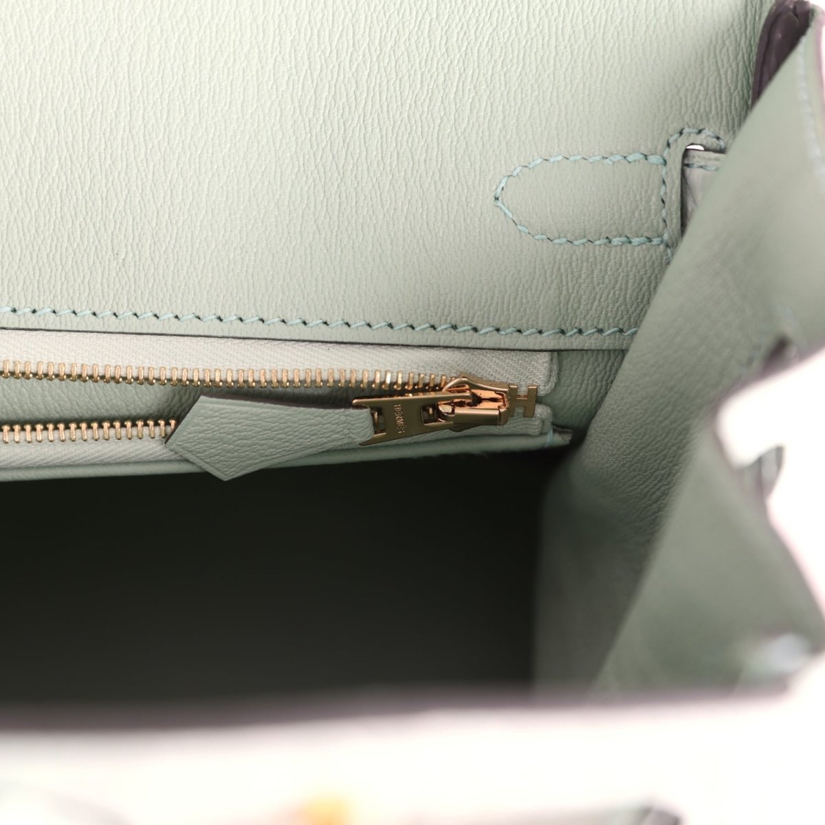 Light green croc-embossed handbag with gold zipper track and stitched trim