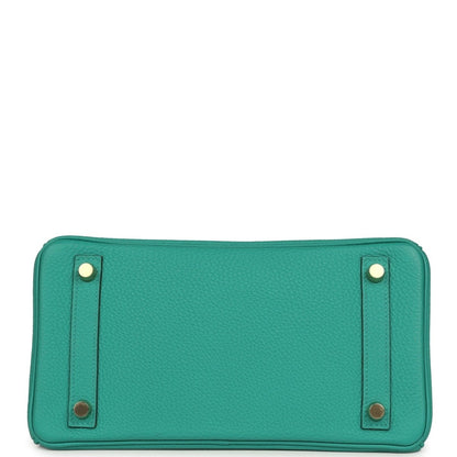 Green leather handbag base with corner studs and rectangular shape