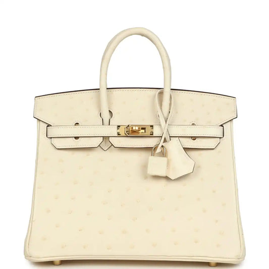Nata ostrich handbag with top handles, front flap, gold-tone lock, and hanging key clochette.