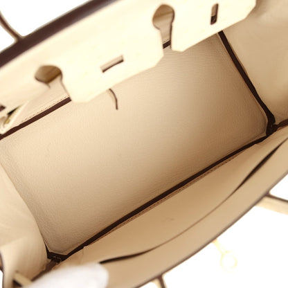 Nata ostrich handbag interior lining with partial zipper track and stitched seams.