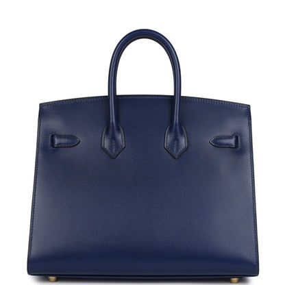 Structured blue Birkin 25 handbag front with three stitched strap details and top handles