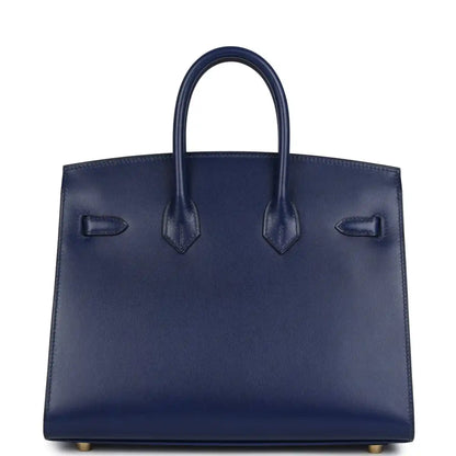Structured blue Birkin 25 handbag front with three stitched strap details and top handles