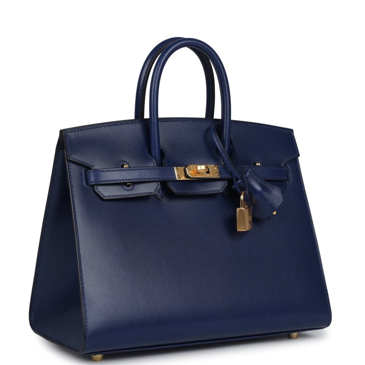 Structured blue handbag with top handles, front flap, gold hardware and hanging lock charm