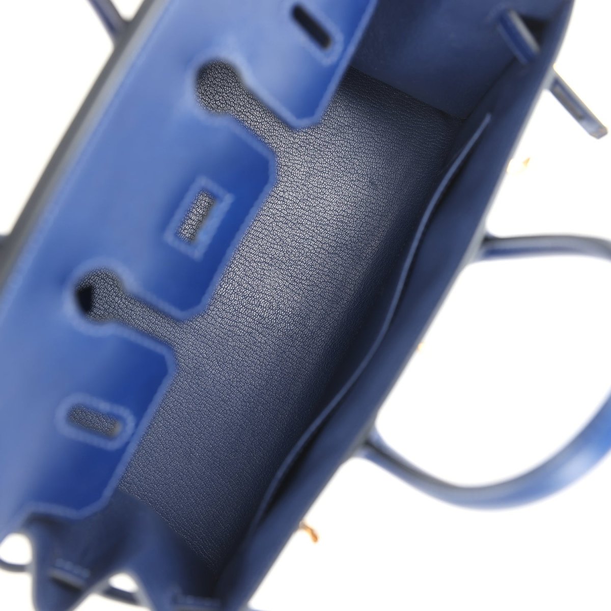 Blue Birkin 25 interior with textured leather grain and partial hardware edge