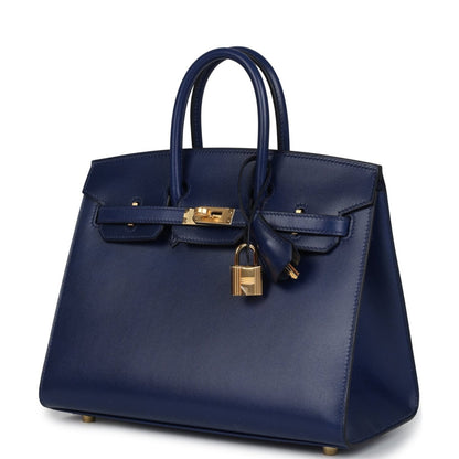 Blue Birkin 25 handbag with top handles, front flap, gold lock and tie-style tassel