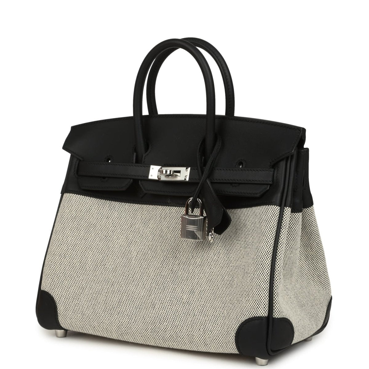 Black and cream canvas Hermes Birkin 25 handbag with front clasp and hanging lock.