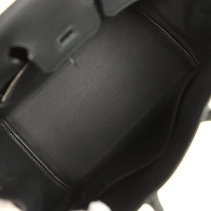 Black leather Hermes Birkin 25 handbag interior with smooth lining and stitched seams.