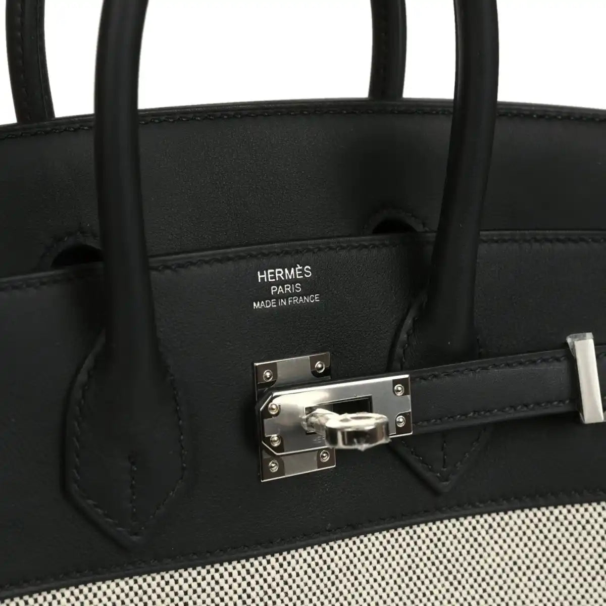 Black leather Hermes Birkin 25 handbag with Hermes stamp and metal front clasp.