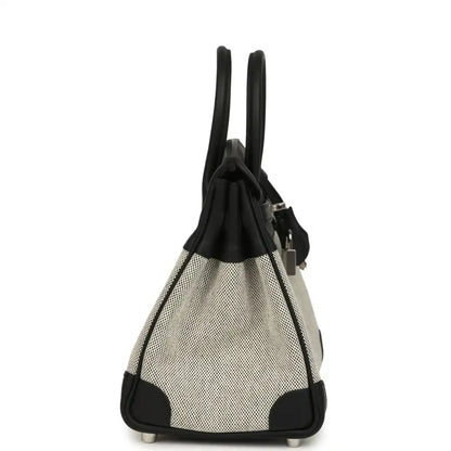 Black and cream canvas Hermes Birkin 25 handbag with side drawstring and feet.